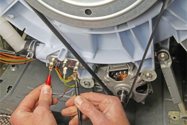 Washing Machine Motor Being Repaired Washing Machine Motor Being Repaired
